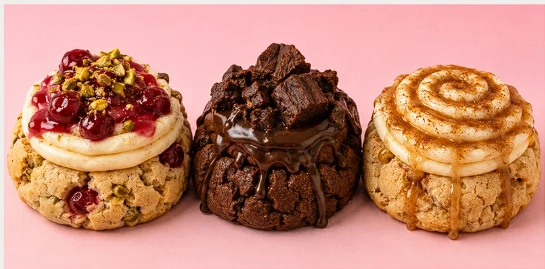 Three CUKI creations with berry, chocolate, and cinnamon toppings